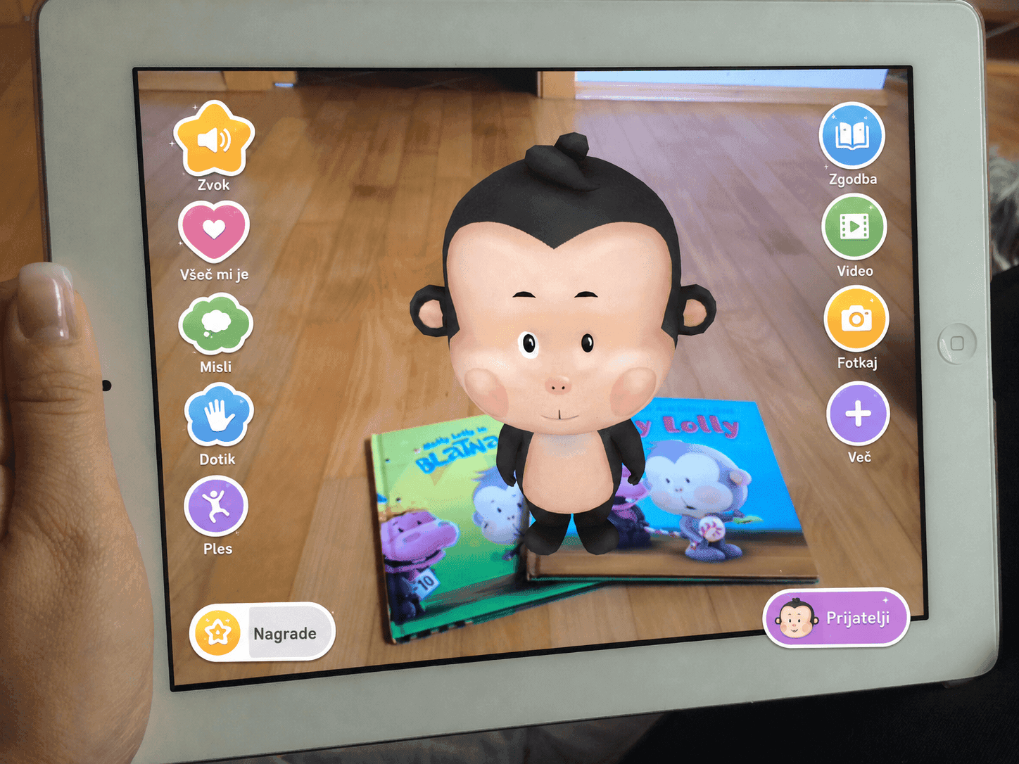 AR app showing 3D monkey on physical book