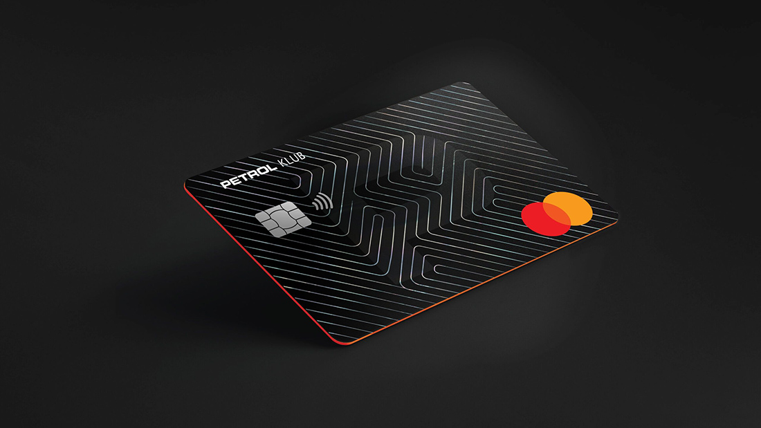 Concept — black Klub card with geometric maze hologram